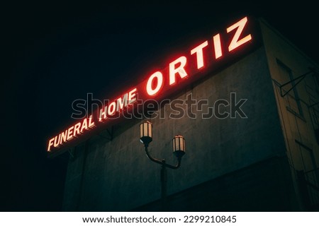 Ortiz Funeral Home neon sign at night, Brooklyn, New York