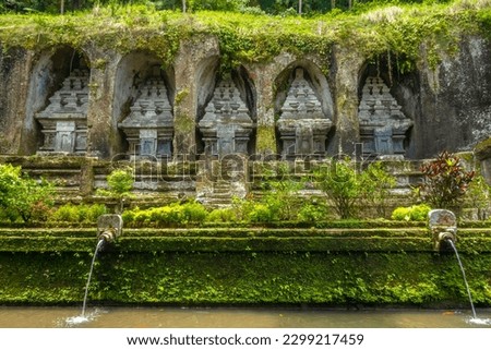 Gunung Kawi Temple or The Valley of The Balinese Kings, an 11th-century temple and funerary complex in Tampaksiring, near Ubud, Bali, Indonesia. Royalty-Free Stock Photo #2299217459