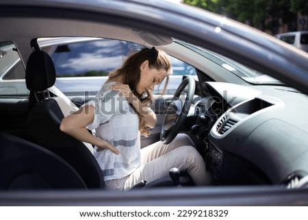 Injury And Car Accident. Whiplash And Hurt Back Royalty-Free Stock Photo #2299218329