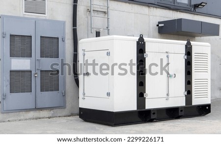 Mobile, standby industrial diesel generator for emergency power supply. Generator with internal combustion engine. For emergency use of electricity outdoors Royalty-Free Stock Photo #2299226171