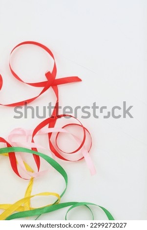 Multicolored festive gift ribbons on a white background, background image, background, photo, for greetings, happy holiday, day, holiday, greetings, wallpaper