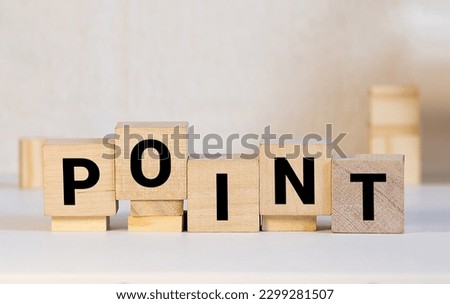 Point Five wooden blocks with POINT text of concept and a light bulb