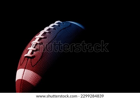 Neon American football ball close up on black background. Horizontal sport theme poster, greeting cards, headers, website and app Royalty-Free Stock Photo #2299284839