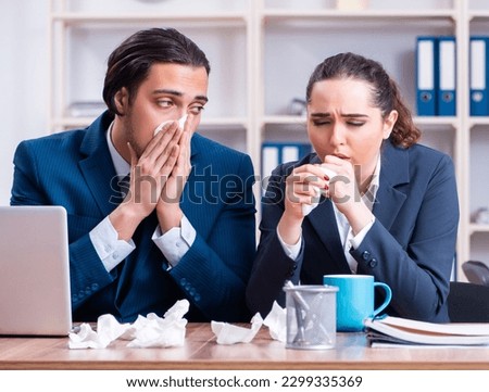 Two employees suffering at workplace