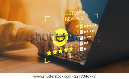Customer Service Experience and Business Satisfaction Surveys. Man hand using laptop computer with smile face popping up and five stars icon for rating, reviews feedback and testimonials. Royalty-Free Stock Photo #2299346779