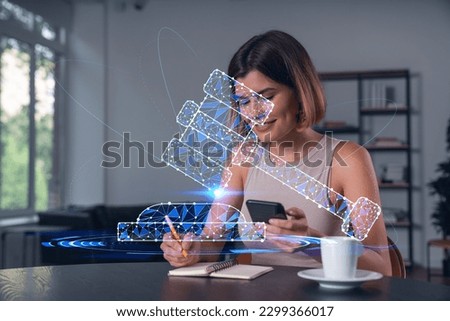 Smiling businesswoman in casual wear holding using smartphone typing at office workplace with notebook. Concept of distant work, business education. Law and legal theme icons hologram