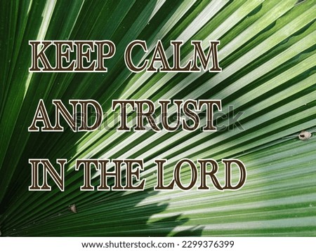 Message saying keep calm and trust in the Lord on natural palm frond.