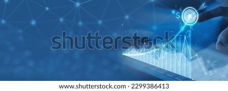 Businesswoman analyzing company financial balance sheet working with digital virtual graphics Businesswoman calculating financial data for long term investment growth goals Royalty-Free Stock Photo #2299386413
