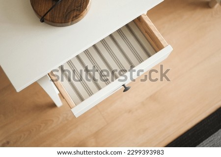 top view of a opened empty drawer  Royalty-Free Stock Photo #2299393983