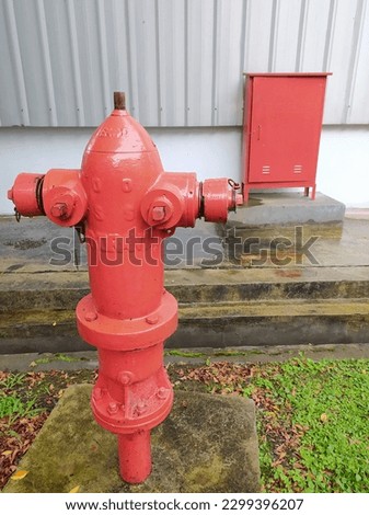 Red Fire Hydrant, red fire hydrant and fire hydrant box for emergencies, fire hydrant to anticipate fires. outdoor.