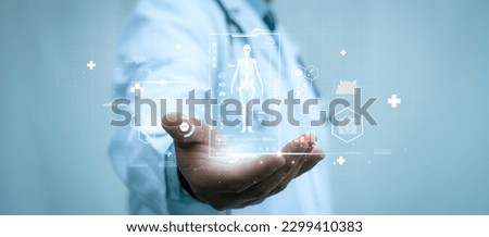 A medical worker holding virtual hologram of human skeleton in his hand on with analysis of human organ with x-ray scanner, Hi-tech technology and medical of the future concept Royalty-Free Stock Photo #2299410383