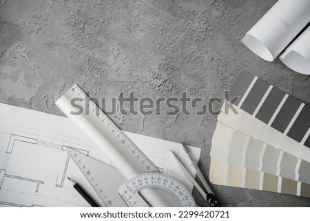 Home floor plans or house building blueprint project, measurement tools and color palette guide catalog with colour swatches. Architect or interior design flat lay composition with copy space. Royalty-Free Stock Photo #2299420721
