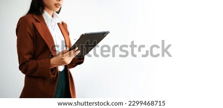 Businesswoman using mobile phone, tablet.Closeup on white background can use for advertising or product presenting concept.