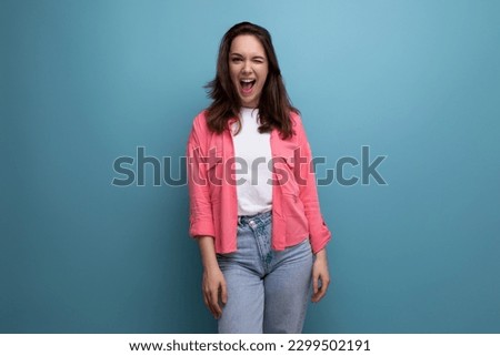 portrait of stylish dark haired young woman with hollywood smile isolated with studio background