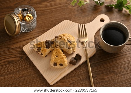Delicious homemade chocolate scones. overlooking Royalty-Free Stock Photo #2299539165