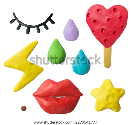 Set of plasticine objects. Handmade ice cream, eyes, lips, stars, lightning bolts, drops. Modelling clay.