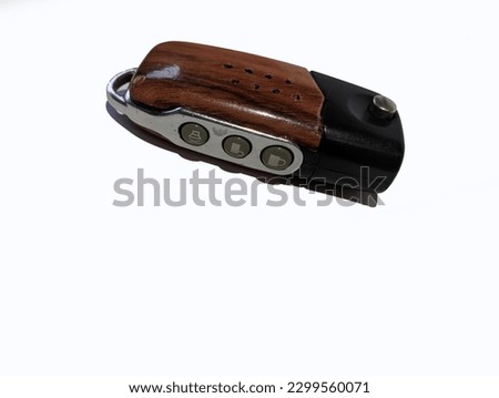 A car remote with a wooden motif isolated on a white background Stock Photo