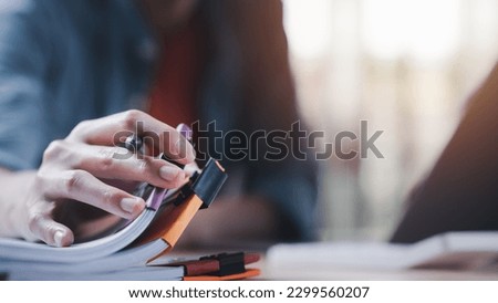 Accountant manages and examines office documents ,accounting documents ,Reports for Tax Time Analysis ,plan review process and assess correctness ,business document evaluation process Royalty-Free Stock Photo #2299560207