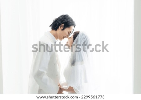 Asian couple getting married. Bridal photo. Photo wedding. Photo studio. Royalty-Free Stock Photo #2299561773