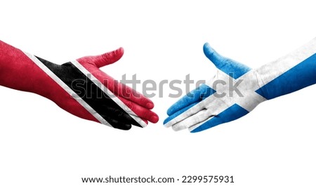 Handshake between Scotland and Trinidad Tobago flags painted on hands, isolated transparent image.