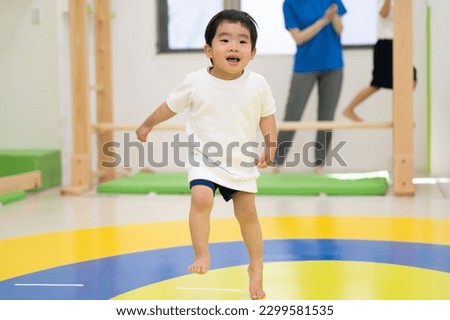 Cute kids enjoying dance and gymnastics in an indoor educational facility.