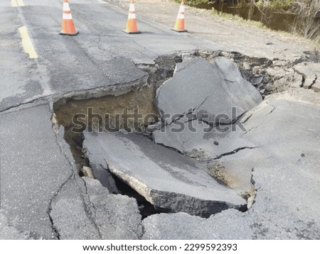 large collapse hole in street Royalty-Free Stock Photo #2299592393