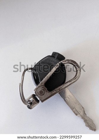 Motorcycle key on a white background.