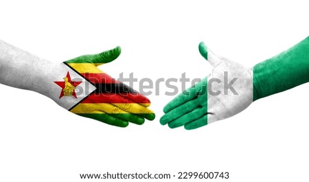 Handshake between Nigeria and Zimbabwe flags painted on hands, isolated transparent image.