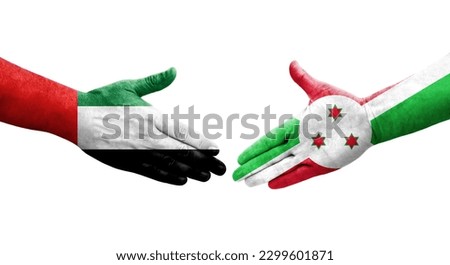 Handshake between Burundi and UAE flags painted on hands, isolated transparent image.