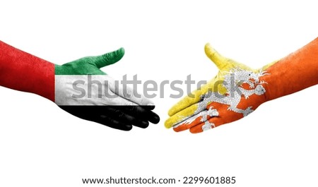 Handshake between Bhutan and UAE flags painted on hands, isolated transparent image.