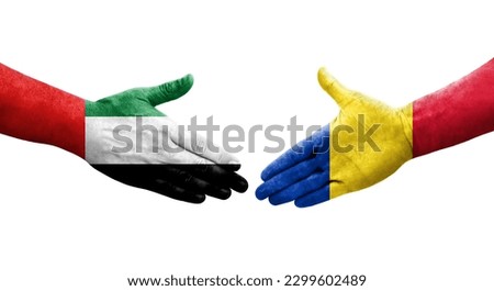 Handshake between Romania and UAE flags painted on hands, isolated transparent image.