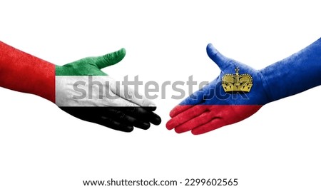Handshake between Liechtenstein and UAE flags painted on hands, isolated transparent image.