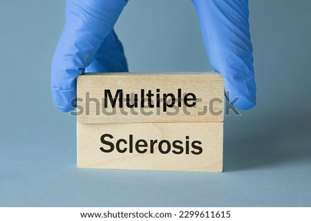 Multiple sclerosis (MS) a disease that affects the nervous system, Written on wooden blocks, Health concept, detection and treatment of rare diseases, close up Royalty-Free Stock Photo #2299611615