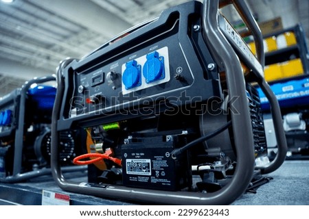 Portable diesel generator AC at the showroom of a large store. Royalty-Free Stock Photo #2299623443