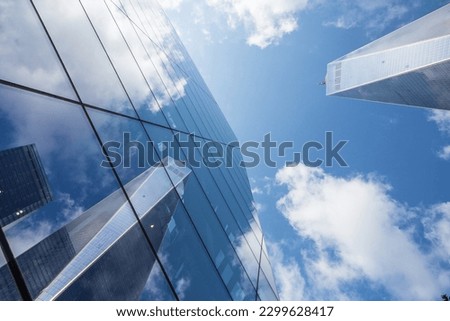 Captivating reflection of New York's iconic skyscrapers, showcasing the city's architectural marvels and urban charm. Royalty-Free Stock Photo #2299628417