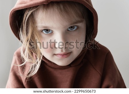 Depressed sad child portrait. Caucasian unhappy little girl, closed kid. Disobedience,loneliness concept. Royalty-Free Stock Photo #2299650673