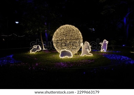 Night light show on the theme of the year of the 12 Zodiac at Vachirabenjatas Park in Bangkok, Thailand.