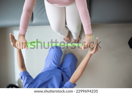 Physical therapists are helping elderly people to take care of themselves after a long period of recovery and they need regular physical therapy to help their bodies recover. physical therapy concept