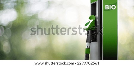 Biofuel filling station on a green background Royalty-Free Stock Photo #2299702561