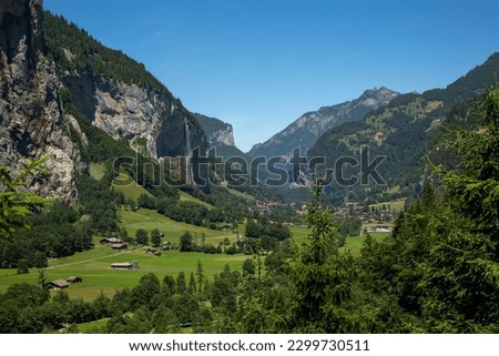 View of Lauterbrunnen, the valley and Staubbach falls during a hot summers day in Switzerland.