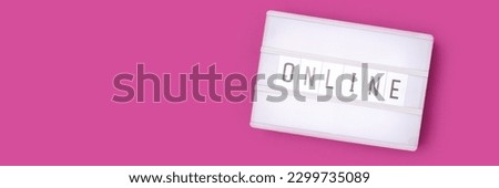Word Online. Banner with white lightbox with letters on a magenta background. 