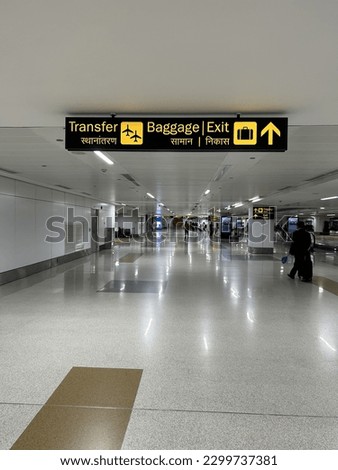 International Airport Sign Exit to Ground Transportation Baggage Claim Gates A in interior air terminal