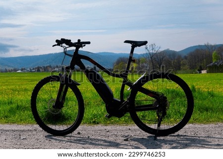 Electric bike on a dirt road. Riding an electric mountain bike