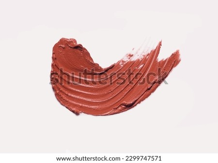 Lipstick or blusher abstract strokes smudges  background texture multi colored red blush isolated on coral background