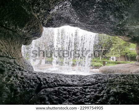 Picture of water flowing from waterfall in nature park cave