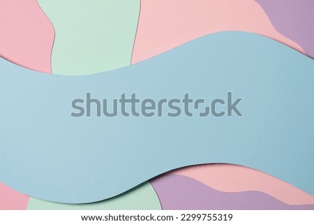 Abstract colored paper texture background. Minimal paper cut composition with layers of geometric shapes and lines in blue, green, purple and pink colors