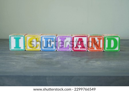 Toy wooden blocks spelling Iceland