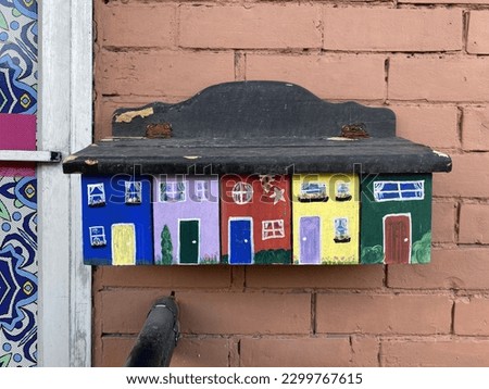 Ottawa Ontario Canada May 6 2023. A restaurant's colourful mailbox with houses painted on it located on Rideau Street.