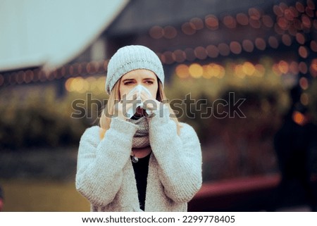 
Sick Woman Suffering from Influenza Blowing her Nose. Ill person having rhinitis during a cold season 
 Royalty-Free Stock Photo #2299778405