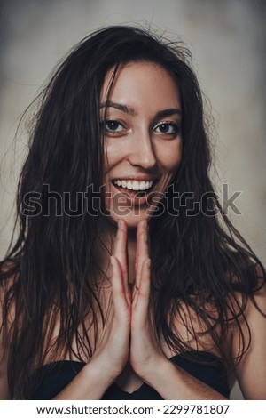 Young smiling brunette woman portrait